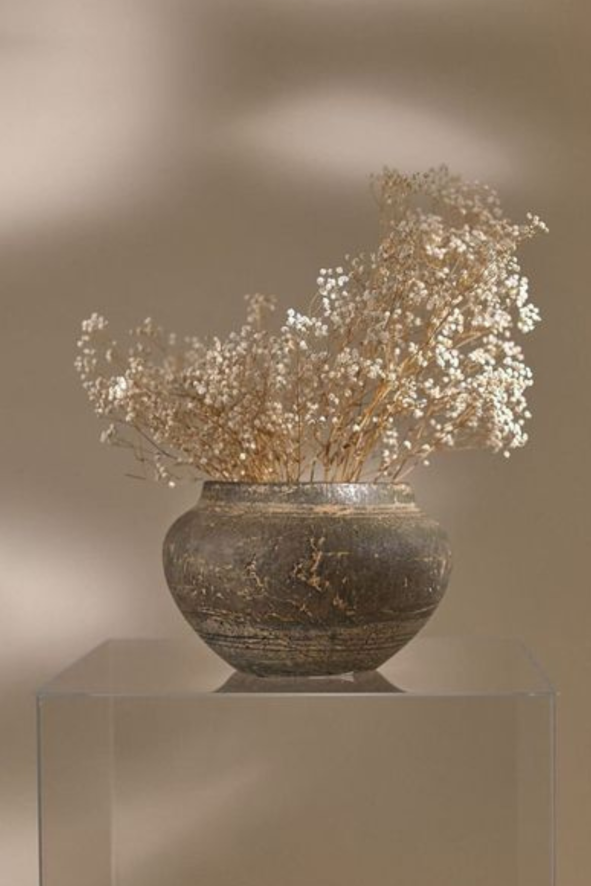 Dried natural babys breath in a a rustic earthen pot